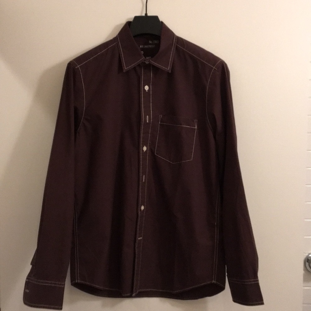 Long-sleeved button-down shirt.